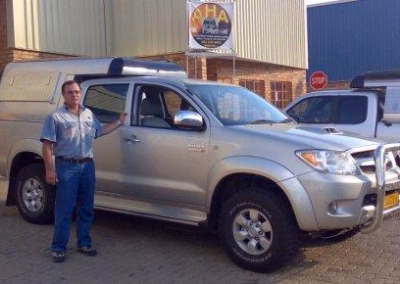 Achim HJ Helm with their AHA-45 on a Toyota Hilux Double Cab, collected at the AHA Outdoor Systems factory.