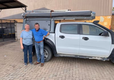 Bob & Carol De Decker with their AHA Transformer on a Ford Ranger Extra Cab, collected at the AHA Outdoor Systems factory, 2021.