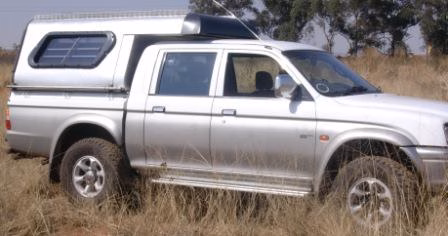 Dawie Maas with their AHA-45 on a Mitsubishi Colt Double Cab, collected at the AHA Outdoor Systems factory.
