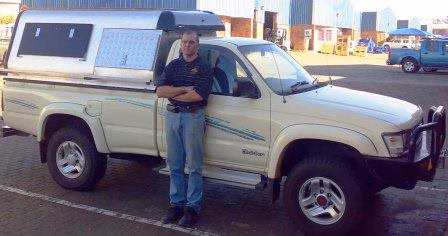 Dries Pretorius with their AHA-45 on a Toyota Hilux Single Cab, collected at the AHA Outdoor Systems factory, 2008.