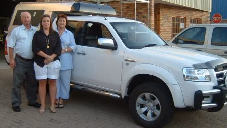 Dupie Le Roux with their AHA-45 on a Ford Ranger Double Cab, collected at the AHA Outdoor Systems factory.