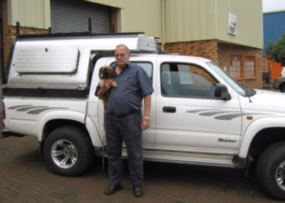 Frans Du Toit with their AHA-45 on a Toyota Double Cab, collected at the AHA Outdoor Systems factory, 2010.