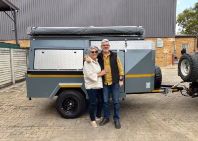 Gert and Leonie Van Rensburg with their AHA Transformer on a Trailer, collected at the AHA Outdoor Systems factory, 2017.