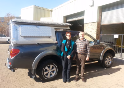 Hennie Van Wyk with their AHA-45 on a Mitsubishi Triton Double Cab, collected at the AHA Outdoor Systems factory, 2012.