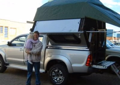 I.R (Ivan) Voigts with their AHA-45 on a Toyota Hilux Double Cab, collected at the AHA Outdoor Systems factory, 2007.