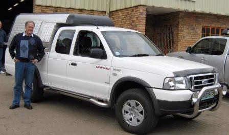 Jan Hugo with their AHA-45 on a Ford Ranger Extra Cab, collected at the AHA Outdoor Systems factory.