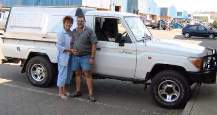John and Petro Symons with their AHA-45 on a Toyota Land Cruiser Double Cab, collected at the AHA Outdoor Systems factory.