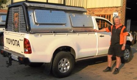 Kobus and Lynette Van Rensburg with their AHA-45 on a Toyota Single Cab, collected at the AHA Outdoor Systems factory, 2011.