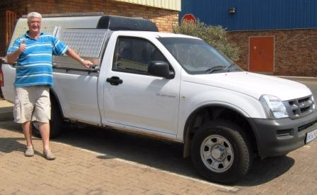 Leon and Martie Hefer with their AHA-45 on a Isuzu KB 300 Single Cab, collected at the AHA Outdoor Systems factory.