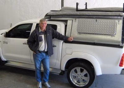 Marius Van Meygaarden with their AHA-45 on a Toyota Hilux Double Cab, collected at the AHA Outdoor Systems factory, 2010.