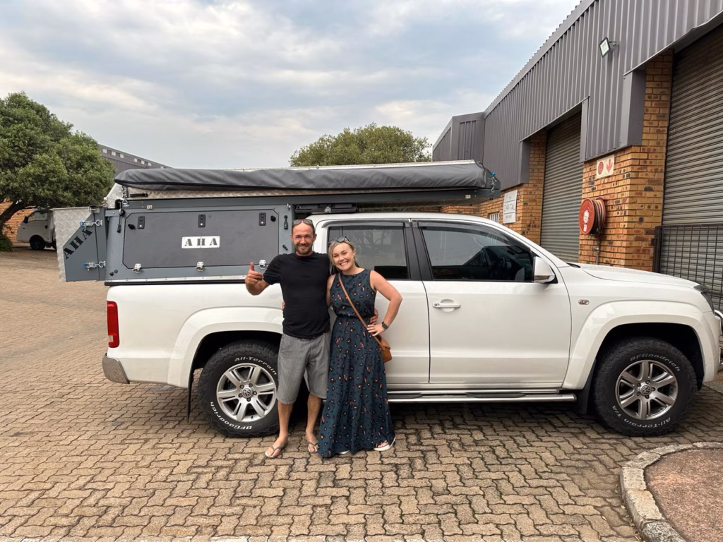 Martin & Amy Raubenheimer | Volkswagen Amarok Double Cab | Hermanus, Western Cape Martin and Amy Raubenheimer with their AHA Transformer on a Volkswagen Amarok Double Cab, collected at the AHA Outdoor Systems factory, 2023.
