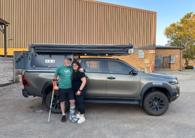 Martin and Natasha Calitz with their AHA Transformer on a Toyota Hilux Double Cab, collected at the AHA Outdoor Systems factory, 2024.