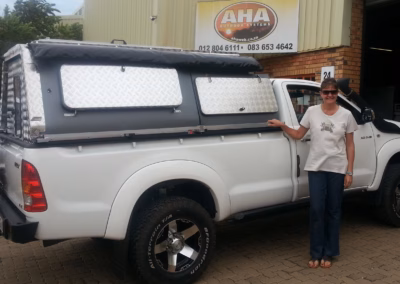 Maryke Cronje with their AHA-45 on a Double Cab, collected at the AHA Outdoor Systems factory, 2013.