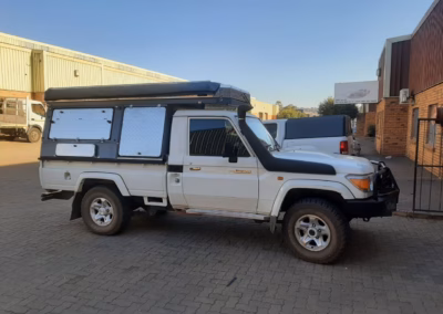 Peter and Sam Rademan with their AHA Transformer on a Toyota Land Cruiser Single Cab, collected at the AHA Outdoor Systems factory, 2021.