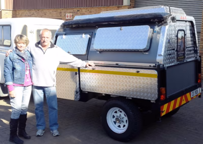 Pierre and Susan Laubscher with their AHA Transformer on a Trailer, collected at the AHA Outdoor Systems factory, 2015.