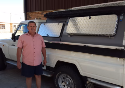 Wikus and Jannetta Visser with their AHA-45 on a Toyota Land Cruiser Single Cab, collected at the AHA Outdoor Systems factory, 2016.