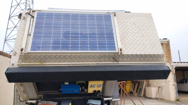 Sun panel of 100 watt on a pre-owned 2015 AHA-45, with the awning out.