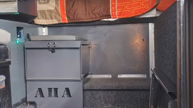 Toilet box storage inside a pre-owned 2024 AHA Transformer.