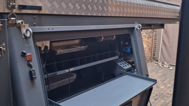 Kitchen compartment open on the right hand side of a pre-owned 2021 AHA Transformer.