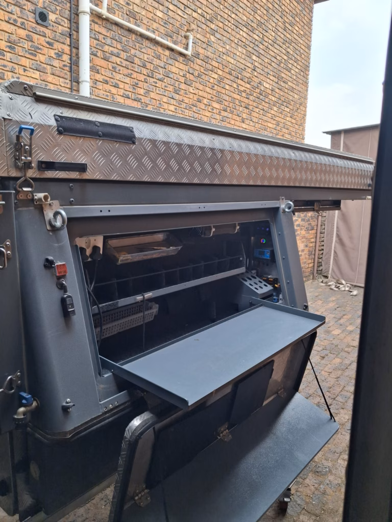 Kitchen compartment open on the right hand side of a pre-owned 2021 AHA Transformer.