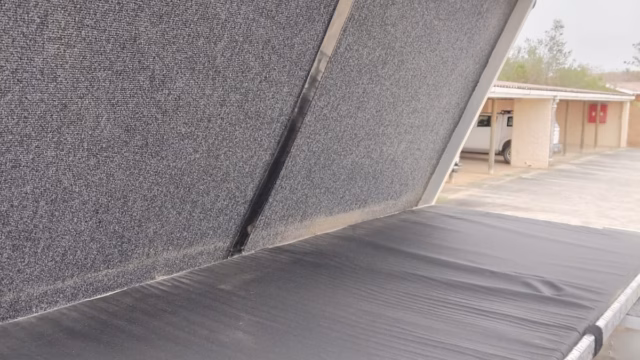 Double bed inside a pre-owned 2015 AHA-45, with the mattress in place.