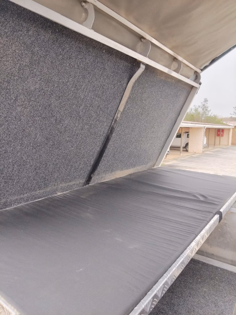 Double bed inside a pre-owned 2015 AHA-45, with the mattress in place.