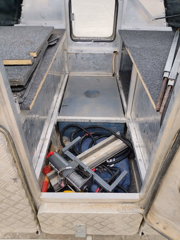 Inside a pre-owned 2015 AHA-45, with the benches and double floor visible.