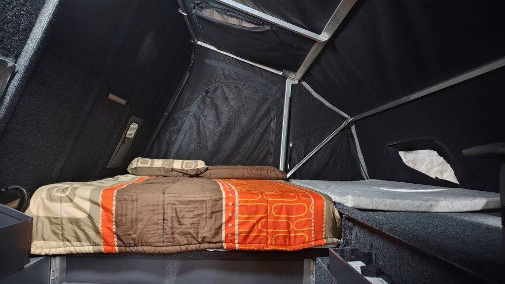 Double bed with the small mattress alongside, inside a 2024 AHA Transformer.