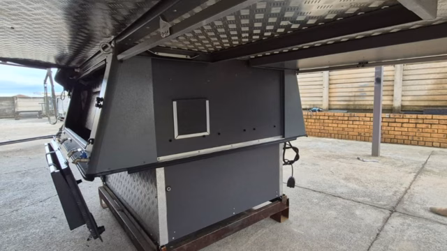 Lower rear of a pre-owned 2023 AHA Transformer, seen from behind.