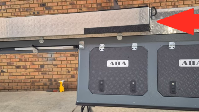 Left hand awning closed against a pre-owned 2023 AHA Transformer.