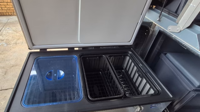 National Luna 90 litre fridge standing open in a pre-owned 2023 AHA Transformer.