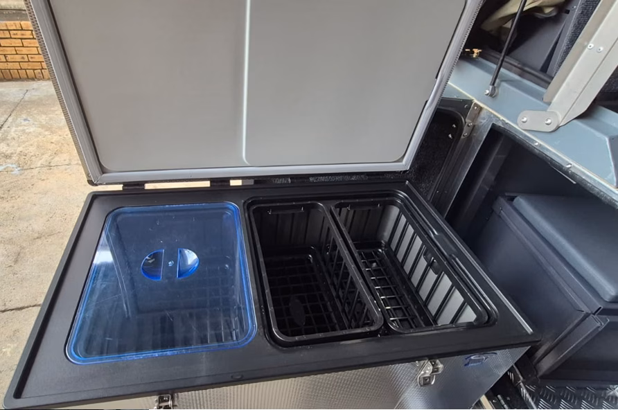 National Luna 90 litre fridge standing open in a pre-owned 2023 AHA Transformer.