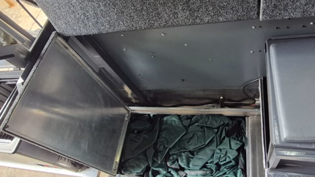 Inside shower of a pre-owned 2023 AHA Transformer, folded away.