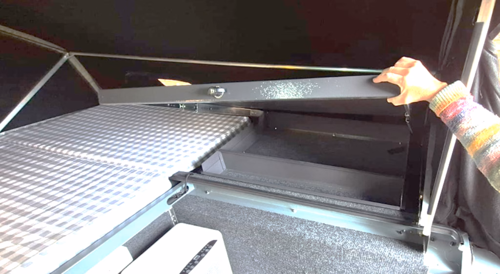 Sliding table and storage open, third view, in a pre-owned 2023 AHA Transformer.