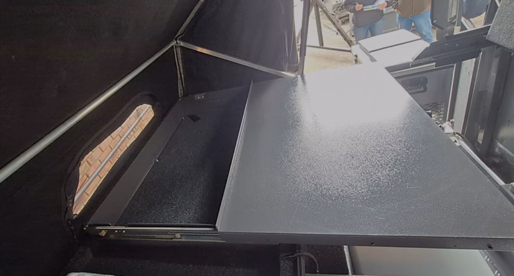 Sliding table and storage open, fourth view, in a pre-owned 2023 AHA Transformer.