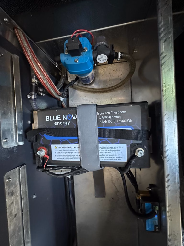 Lithium battery of 154 A/H and the water pump in the under bed compartment.