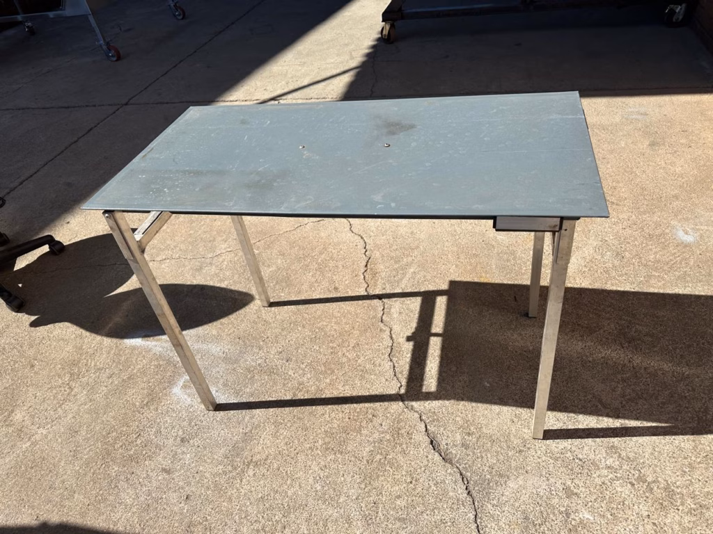 Outside table on its mounting bracket, 1 000mm by 500mm, fitted to the Transformer.