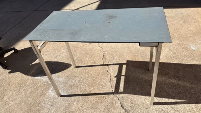 Outside table on its mounting bracket, 1 000mm by 500mm, fitted to the Transformer.